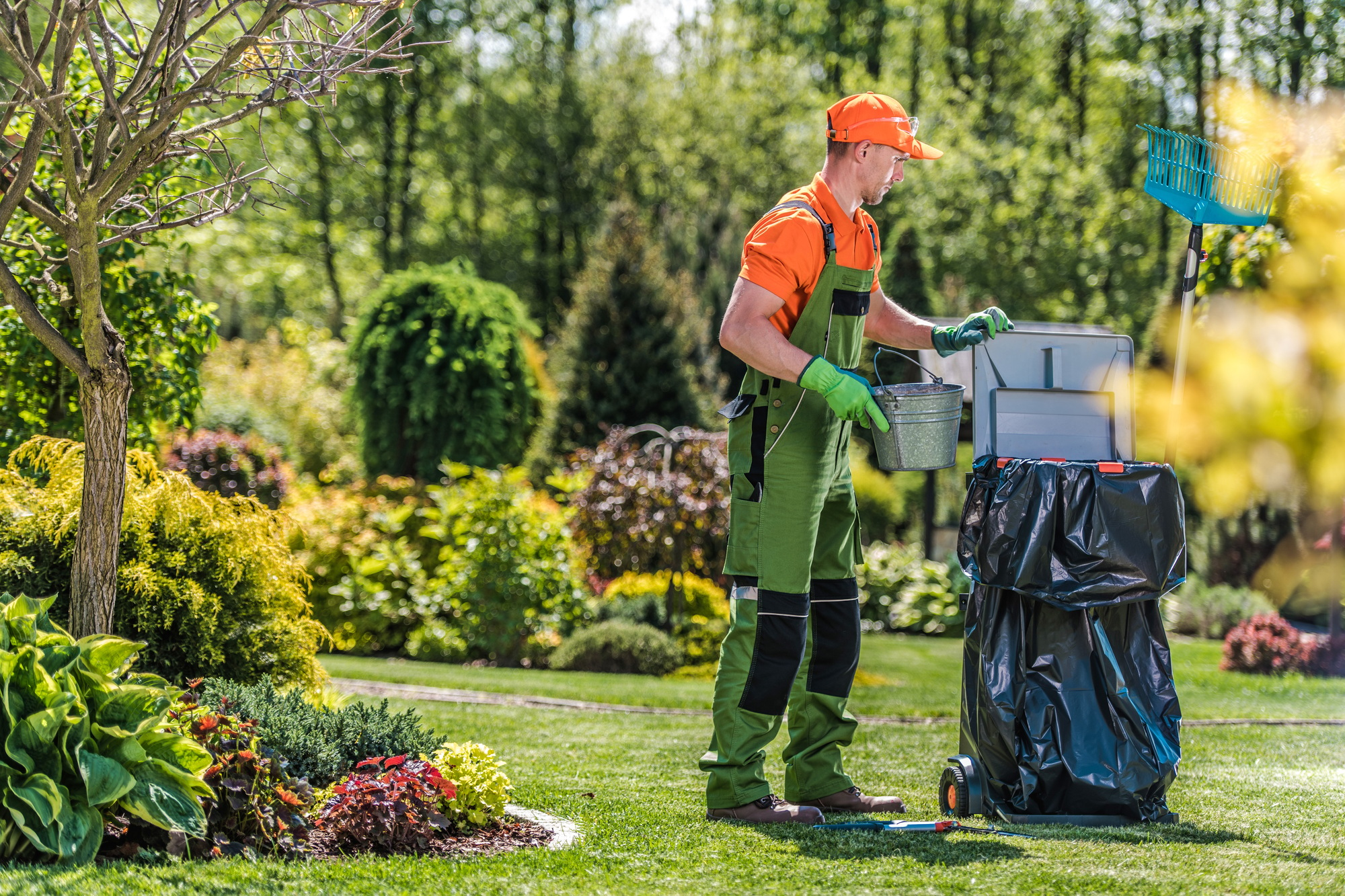 Gardener Cleans Private Yard Area After Routine Maintenance.